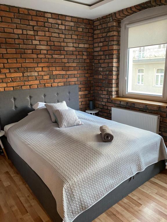 Posteľ alebo postele v izbe v ubytovaní Apartament Pogodny