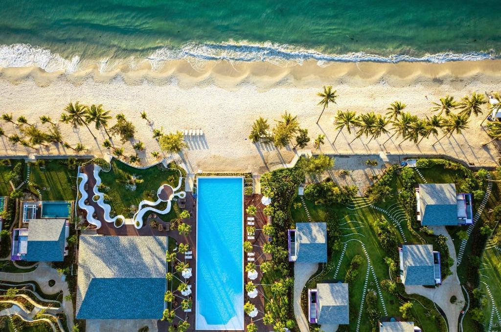 an aerial view of a resort with a beach at TTC Van Phong Bay Resort - Himalaya Sauna & Steam Retreat Included in Ninh Hòa