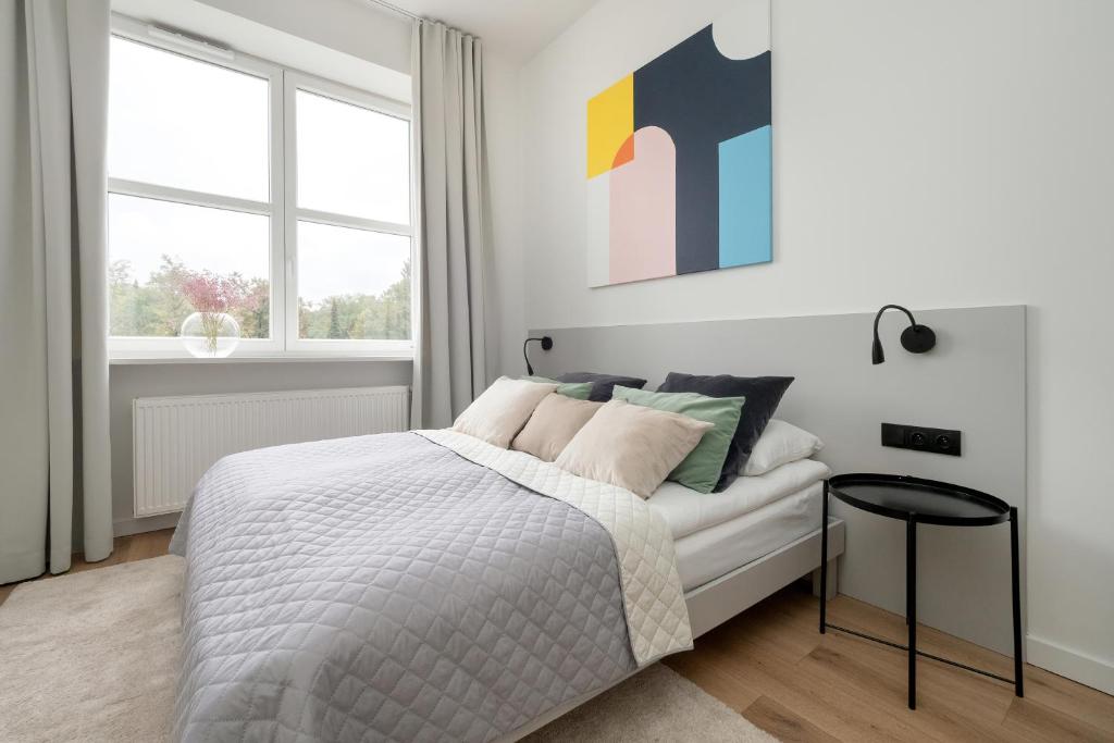 Posteľ alebo postele v izbe v ubytovaní Gagarina Warszawa Przytulne Studio by Noclegi Renters