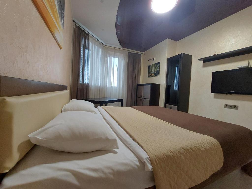 Postel nebo postele na pokoji v ubytování Романтичні апартаменти у центрі