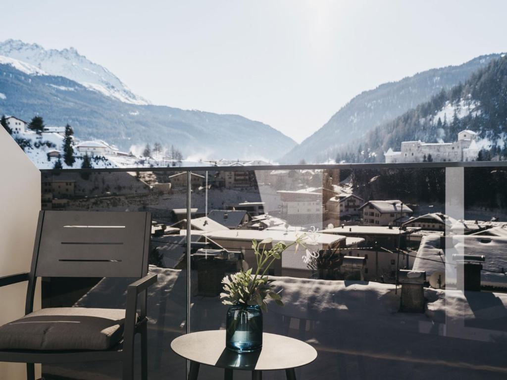 a balcony with a view of a snow covered mountain at VAYA Nauders inklusive Summercard Basic in Nauders