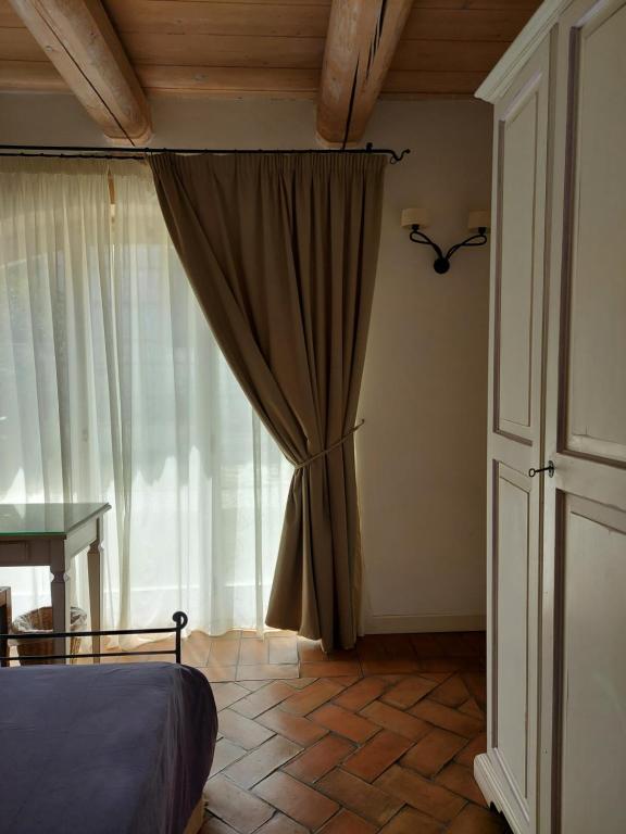 Postel nebo postele na pokoji v ubytování Valcastagno Relais & Residence