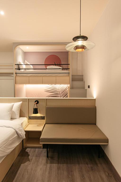 Postel nebo postele na pokoji v ubytování True Blue Hotel Menteng