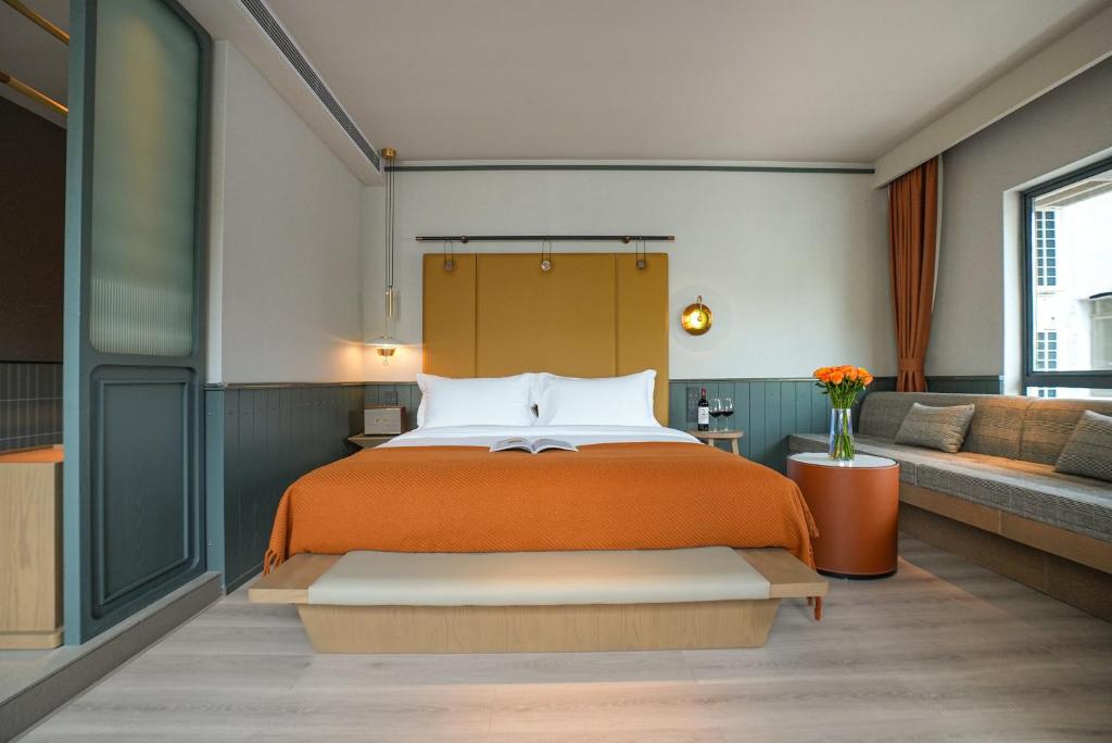 Postel nebo postele na pokoji v ubytování Shenzhen Xili Ruixi Hotel