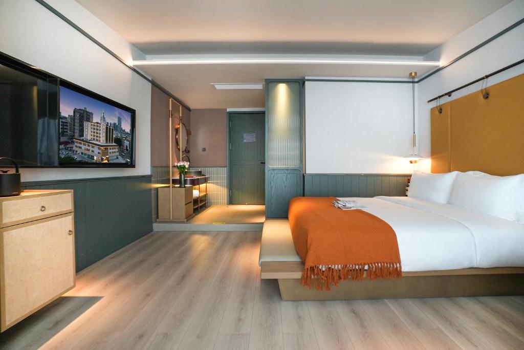 Postel nebo postele na pokoji v ubytování Shenzhen Xili Ruixi Hotel