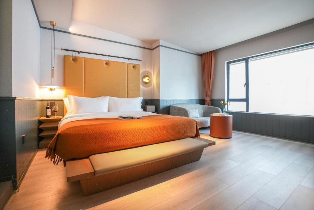 Postel nebo postele na pokoji v ubytování Shenzhen Xili Ruixi Hotel
