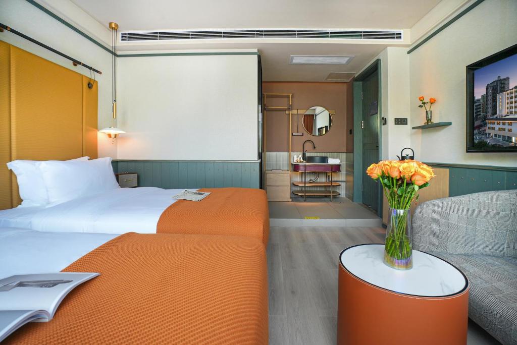 Postel nebo postele na pokoji v ubytování Shenzhen Xili Ruixi Hotel