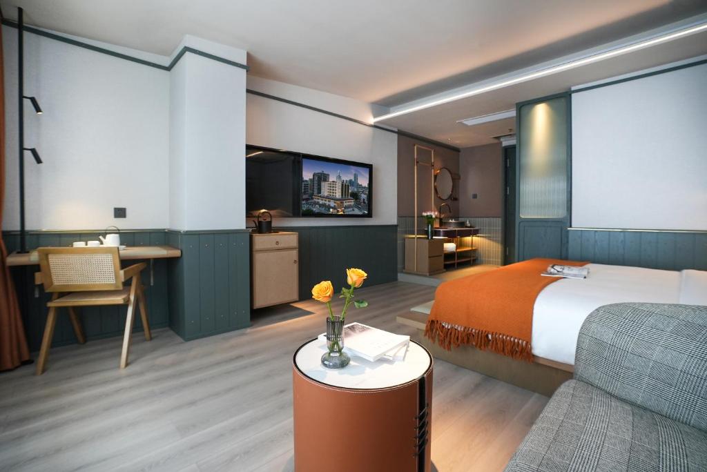 TV a/nebo společenská místnost v ubytování Shenzhen Xili Ruixi Hotel