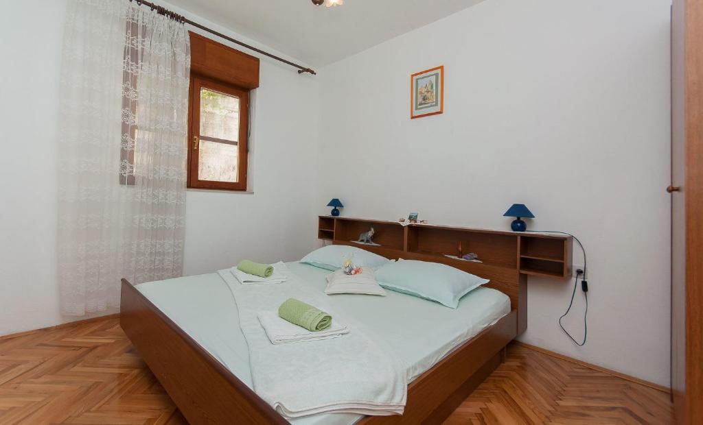 Posteľ alebo postele v izbe v ubytovaní Apartments Franka