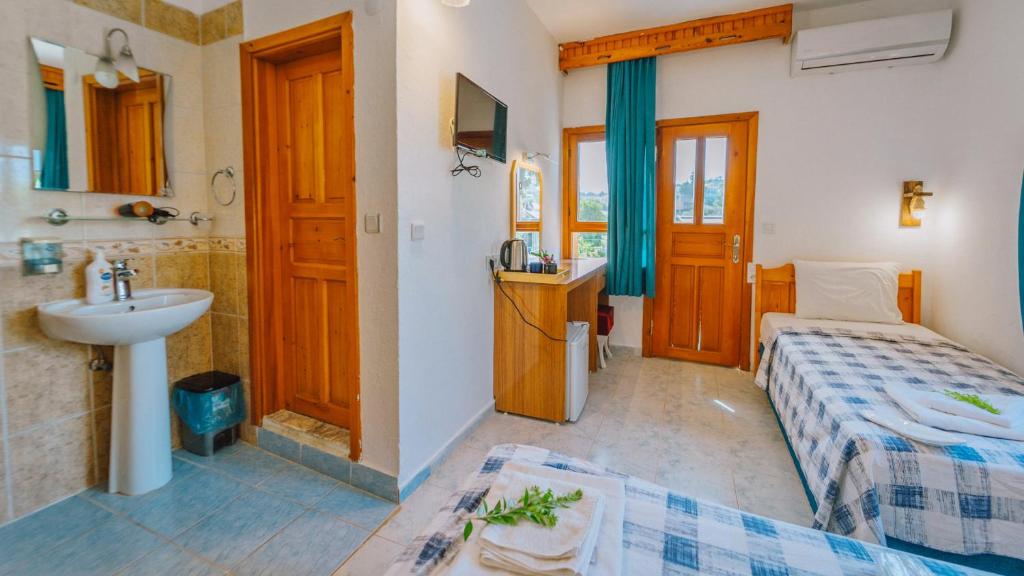 Кровать или кровати в номере St. Nicholas Pension