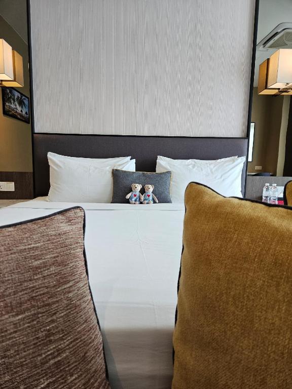 Voodi või voodid majutusasutuse The Langkawi Luxury toas