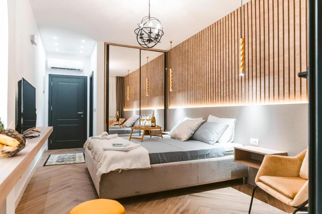 a bedroom with a large bed and a couch at CAROLEA VILLAS in Ulcinj