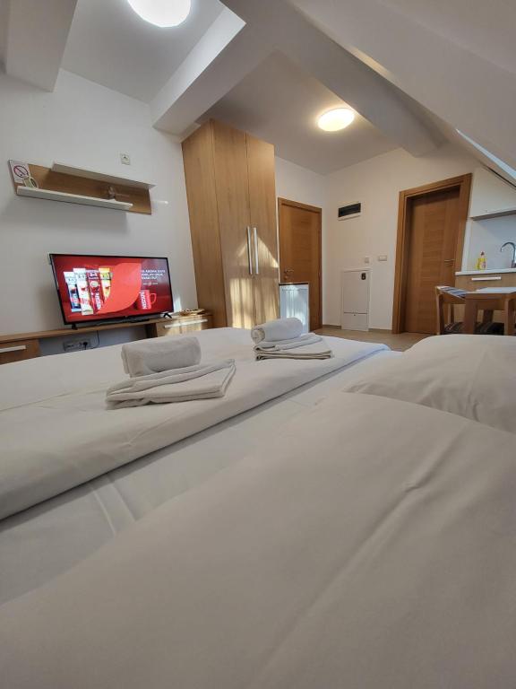 Postel nebo postele na pokoji v ubytování Lovac apartmani