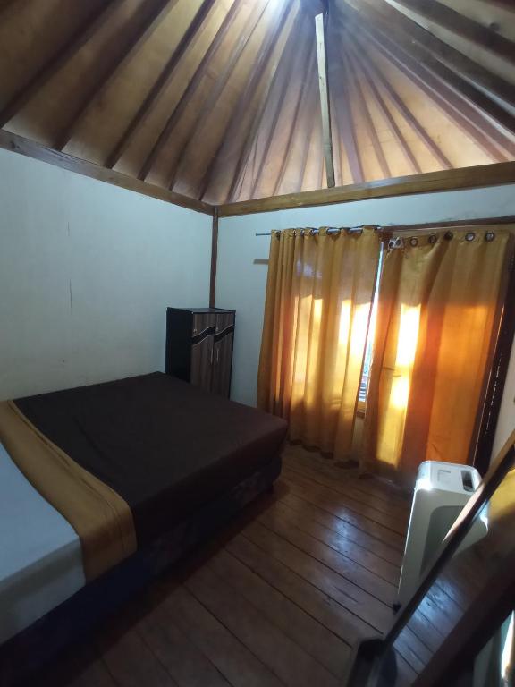Postel nebo postele na pokoji v ubytování Lombok Collection Gili Air