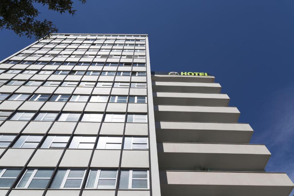 a building with a hotel sign on top of it at B&B Hotel Pescara in Pescara