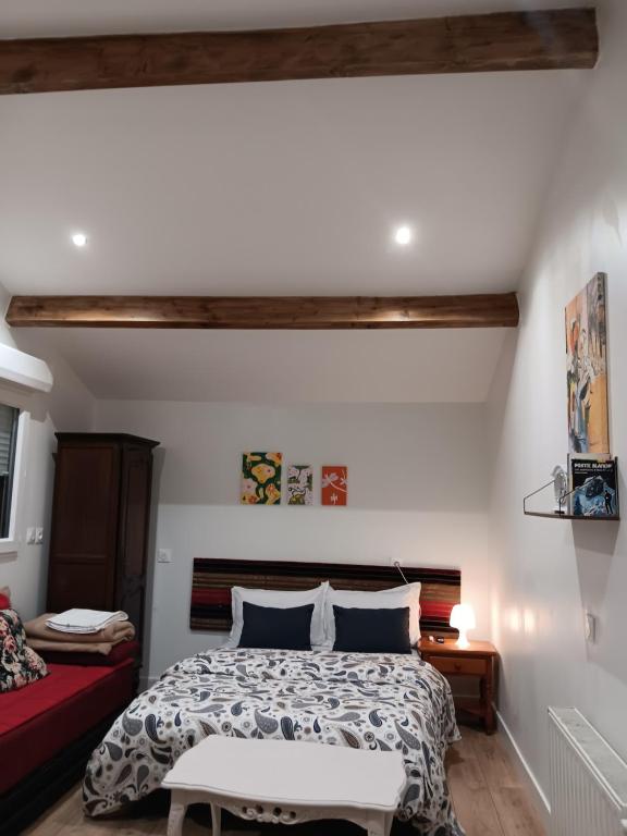 Postel nebo postele na pokoji v ubytování studio maisonette