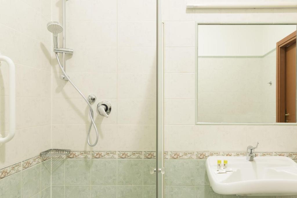 a bathroom with a shower and a sink at B&B Hotel Pescara in Pescara