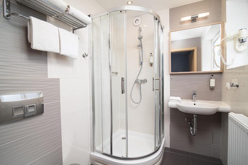 Koupelna v ubytování Antares Hotel