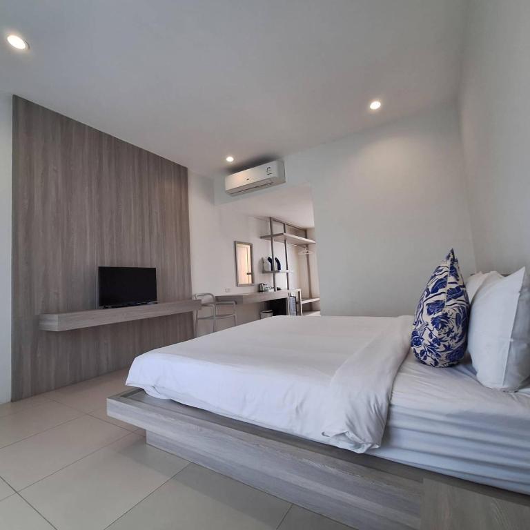 Postel nebo postele na pokoji v ubytování Baanfah Resort Samui