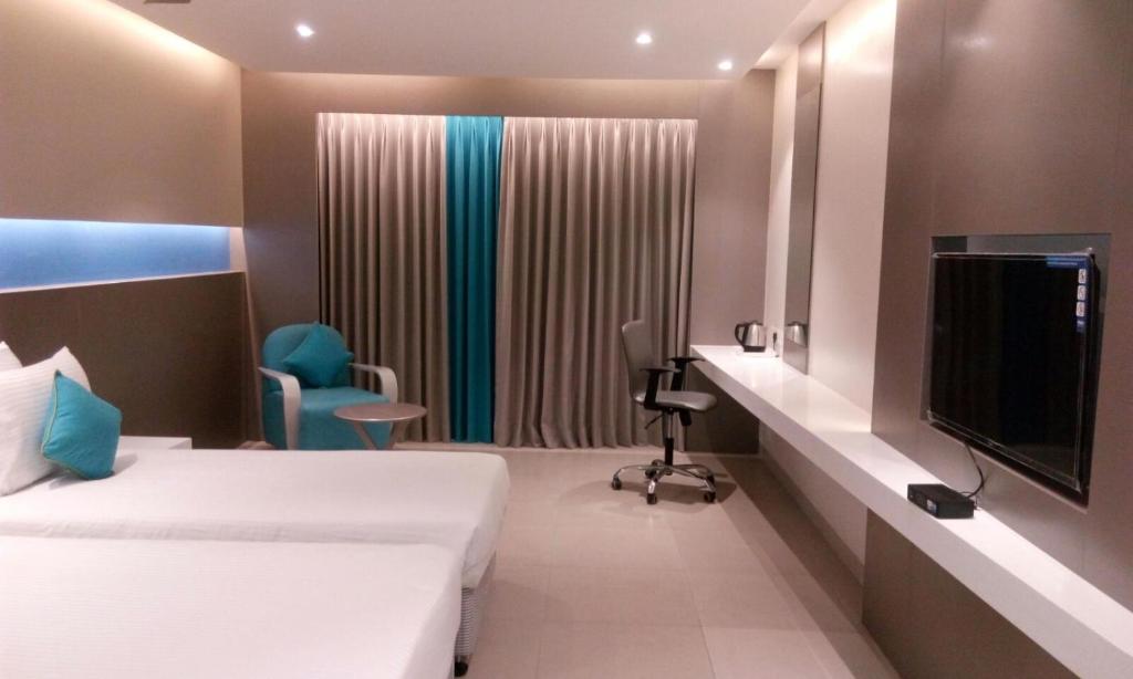 Postel nebo postele na pokoji v ubytování ZIBE Coimbatore by GRT Hotels