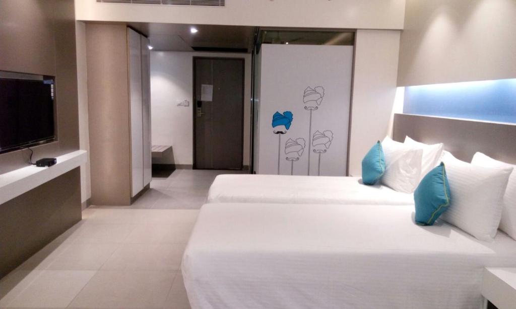 Postel nebo postele na pokoji v ubytování ZIBE Coimbatore by GRT Hotels