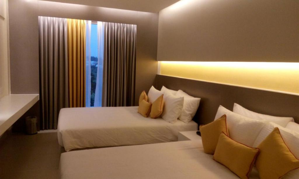 Postel nebo postele na pokoji v ubytování ZIBE Coimbatore by GRT Hotels