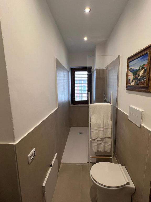 a bathroom with a toilet and a shower at Domus Orestea Luxury Suites in Palermo
