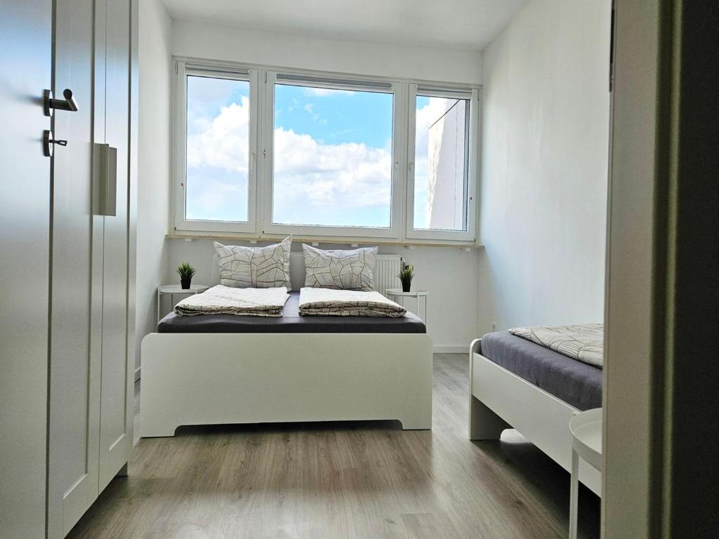 Ένα ή περισσότερα κρεβάτια σε δωμάτιο στο City Apartment in Eppelheim near Heidelberg