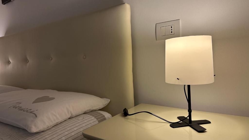 Postel nebo postele na pokoji v ubytování B&B Le Colombine