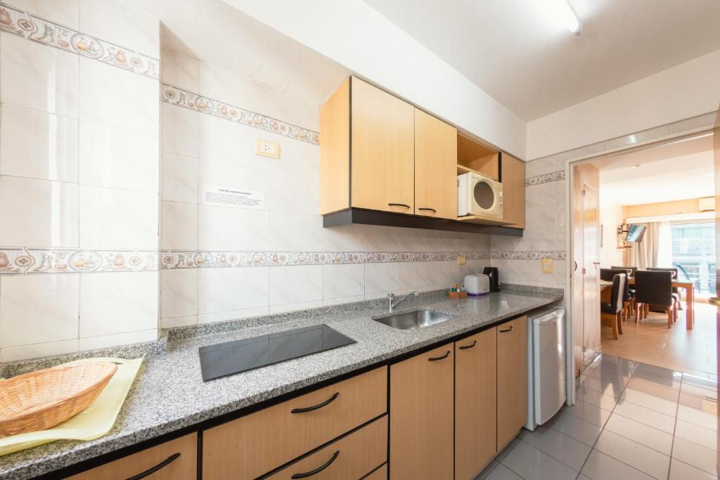 Kuchyň nebo kuchyňský kout v ubytování Le Batiment Apartmentos