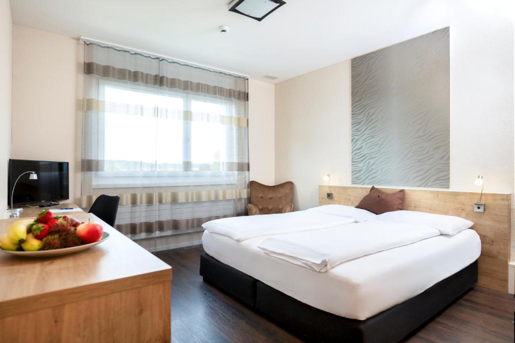 Postel nebo postele na pokoji v ubytování Villmergen Swiss Quality Hotel