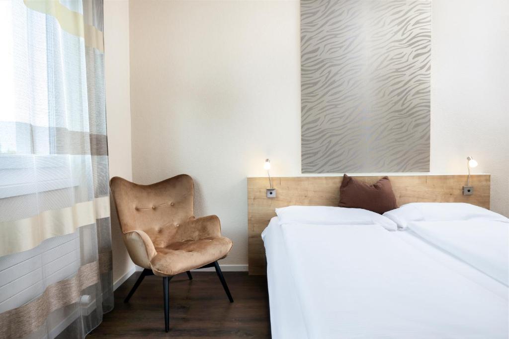 Postel nebo postele na pokoji v ubytování Villmergen Swiss Quality Hotel