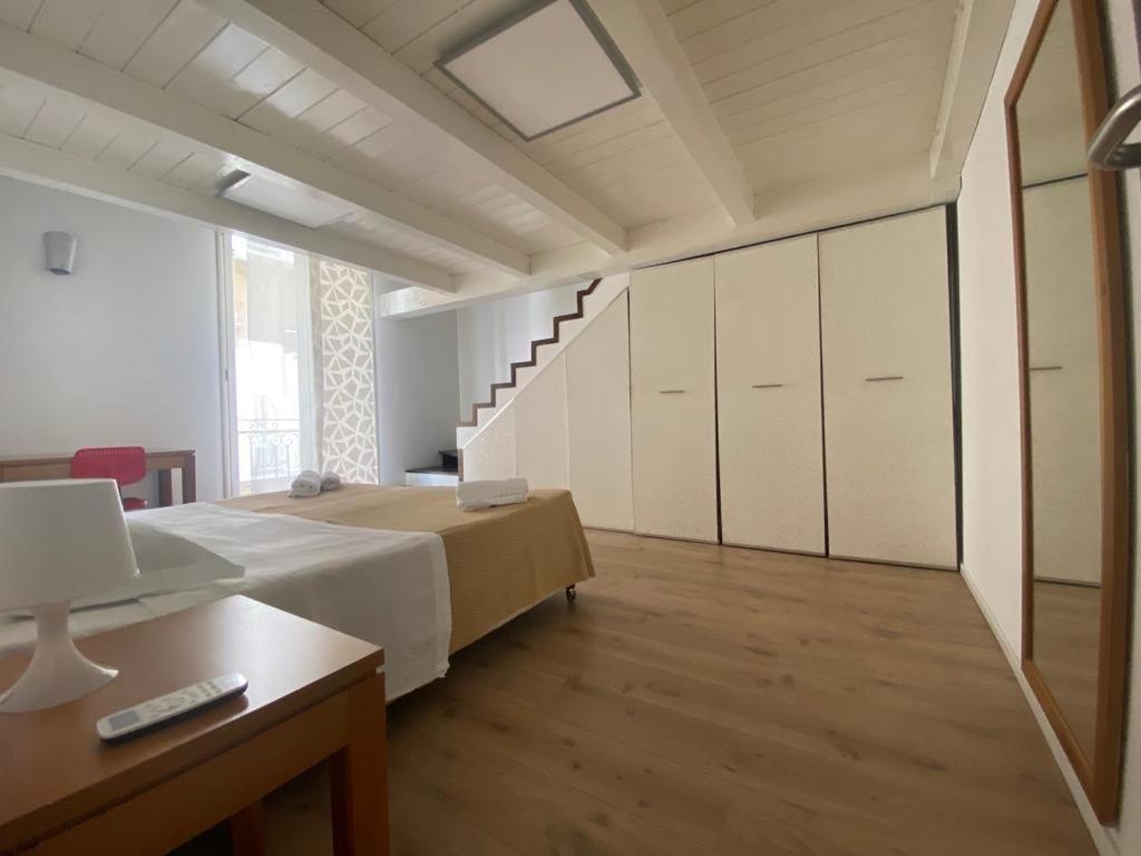 Кровать или кровати в номере Prince Suite Palermo