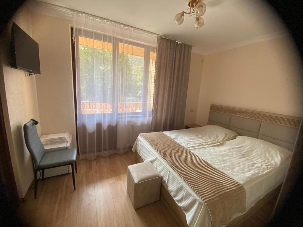Postel nebo postele na pokoji v ubytování Dililuxe Hotel