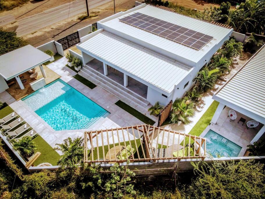 an aerial view of a house with a swimming pool at NEW Luxury 5BR Villa - Casa Graziano by Bocobay in Oranjestad