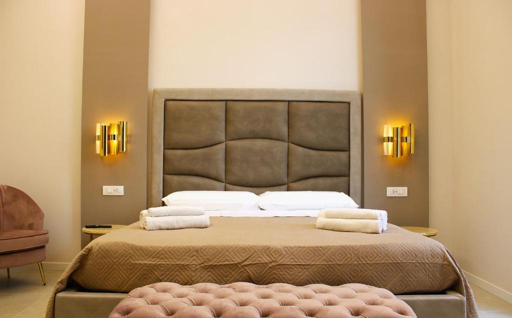Postel nebo postele na pokoji v ubytování InCentro Elegant Rooms