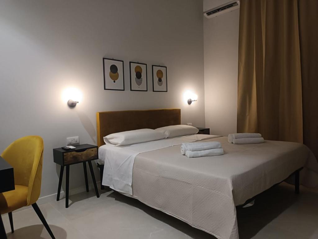 Postel nebo postele na pokoji v ubytování InCentro Elegant Rooms