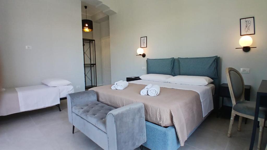 Postel nebo postele na pokoji v ubytování InCentro Elegant Rooms