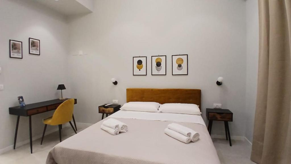 Postel nebo postele na pokoji v ubytování InCentro Elegant Rooms