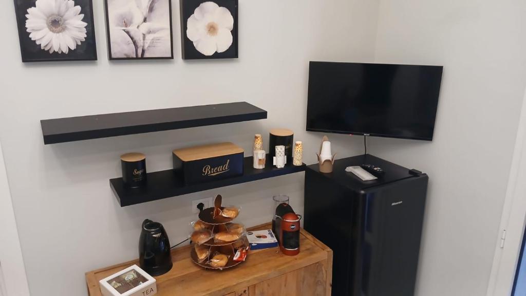 TV a/nebo společenská místnost v ubytování InCentro Elegant Rooms