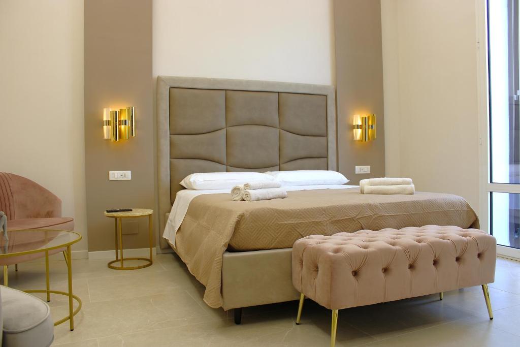Postel nebo postele na pokoji v ubytování InCentro Elegant Rooms