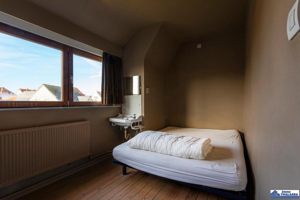 Postel nebo postele na pokoji v ubytování Rafiki