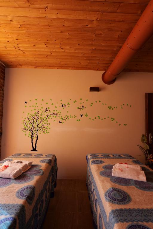 Postel nebo postele na pokoji v ubytování Hotel Le Botti