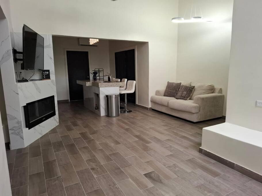 a living room with a sink and a couch at Spacious 3-Bed, 2-Bath Home in Puerto Peñasco
