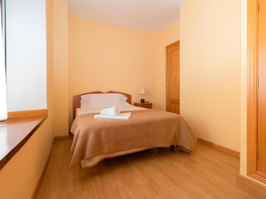 Postel nebo postele na pokoji v ubytování Apartamentos Canfranc 3000