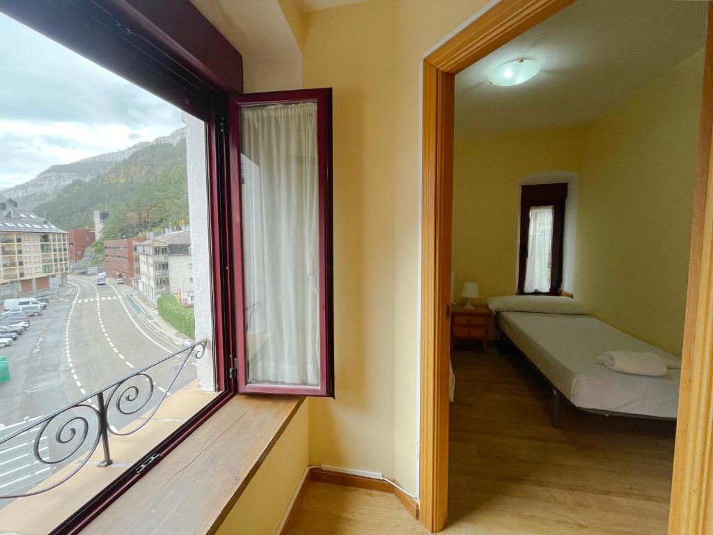 Postel nebo postele na pokoji v ubytování Apartamentos Canfranc 3000