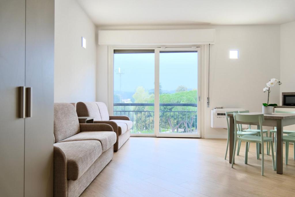 a living room with a couch and a table at Colombo - Boutique Home in Florence in Florence