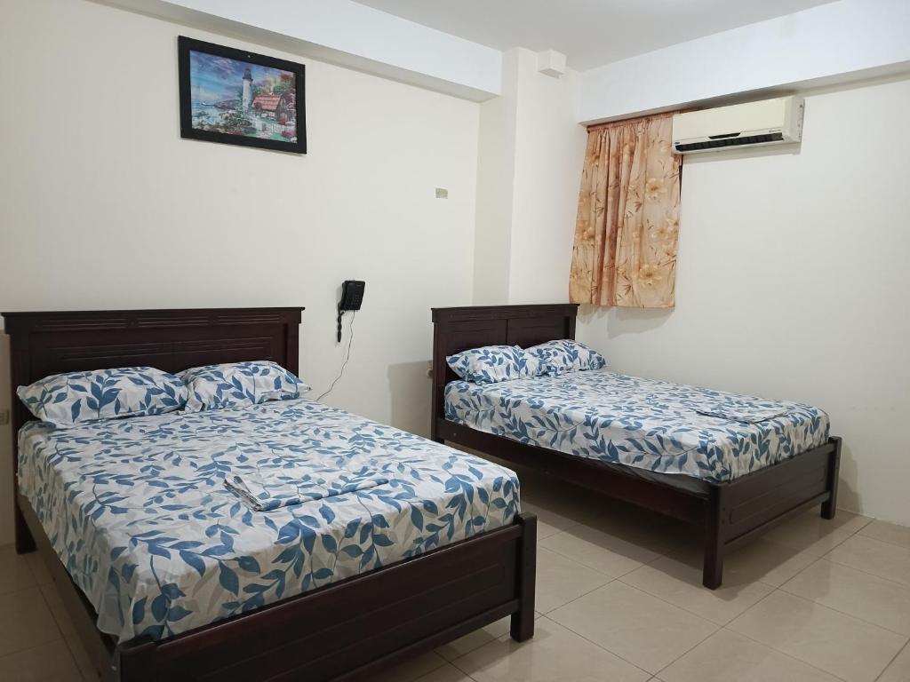 Postel nebo postele na pokoji v ubytování Hotel JIRA