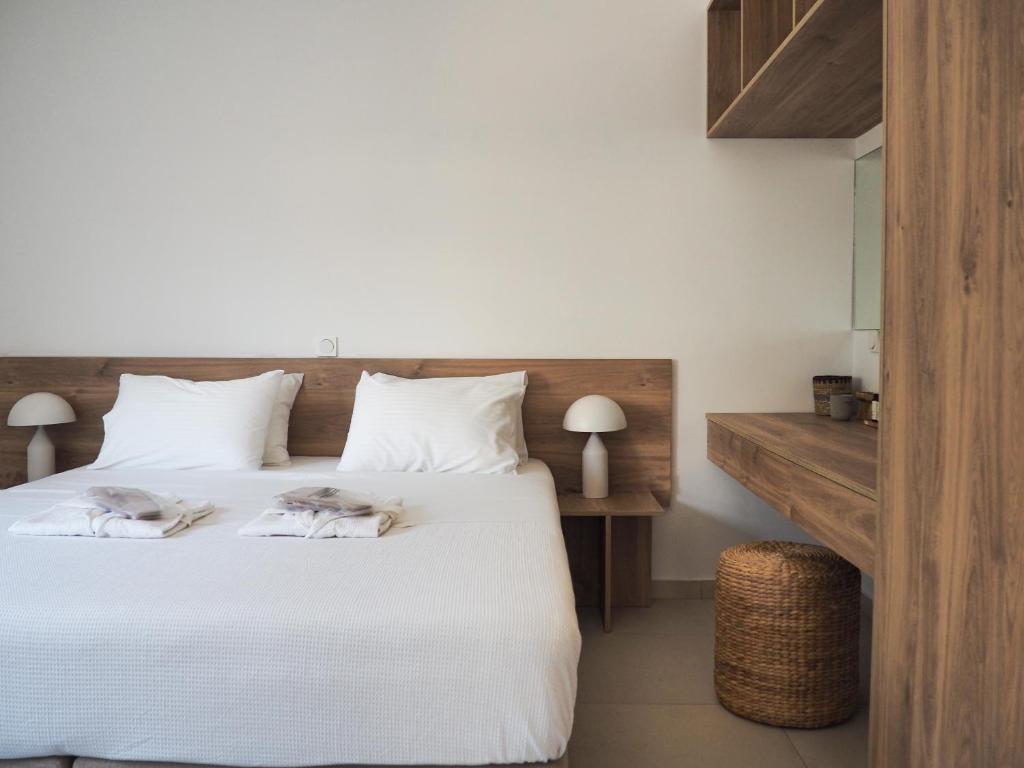 Postel nebo postele na pokoji v ubytování Trinity Urban Residences Plumeria