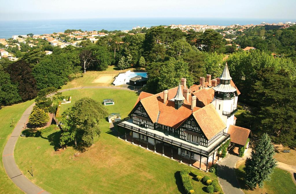 an aerial view of a large house with a turret at VTF Le Domaine de Françon in Biarritz